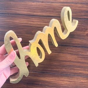 Gold cursive ‘home’ decorative shelf sign